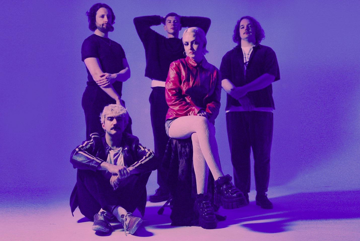 The five band members of just mustard in a photo studio